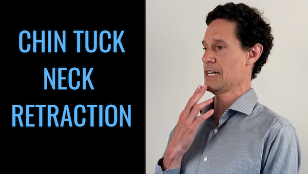 Individual practicing good posture while using a computer to prevent tech neck.