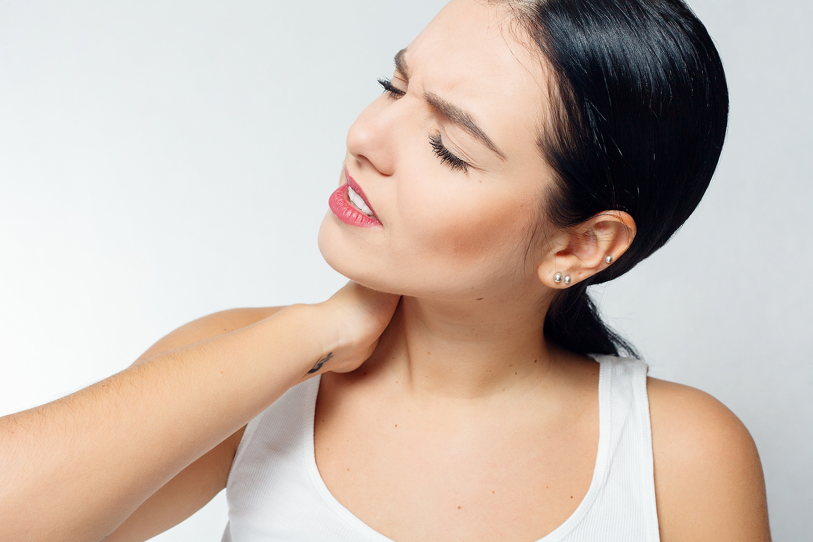 Woman having neck pain