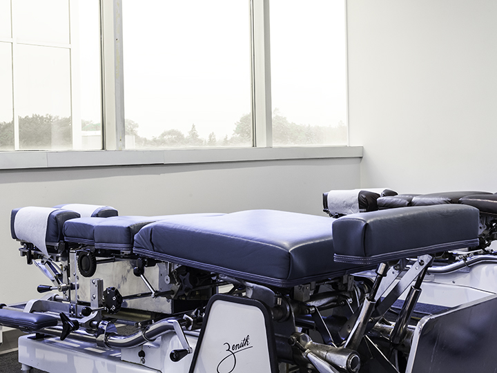 Chiropractor applying specialized pregnancy chiropractic technique to a pregnant patient